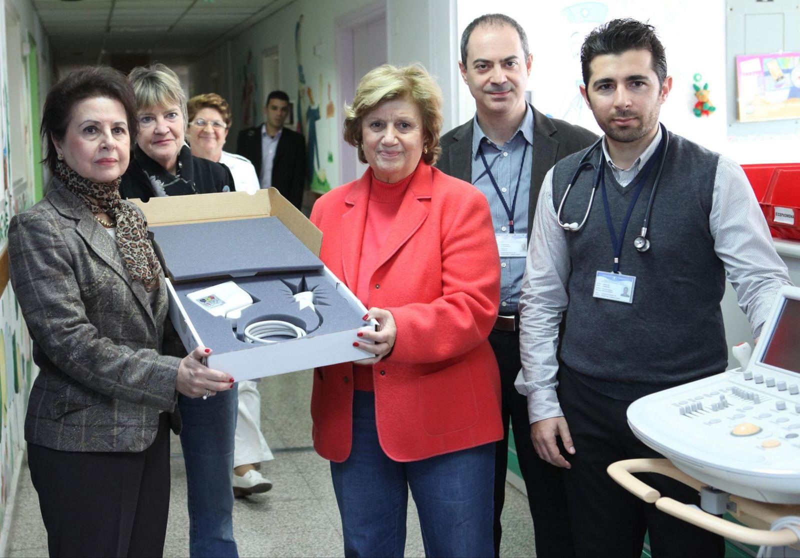 Cans For Kids presenting donated medical equipment at a hospital